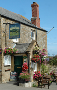 the new inn with flower baskets
